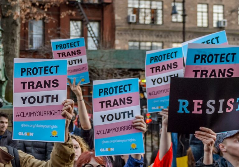 image of people holding signs at protest